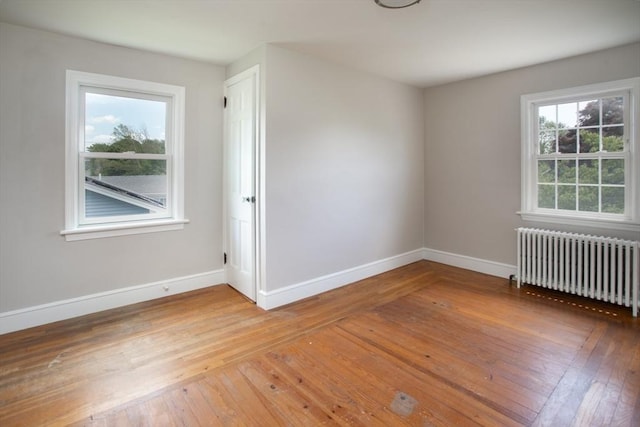 329 Read St, Somerset, MA 02726 - empty room featuring radiator heating unit and hardwood / wood-style floors