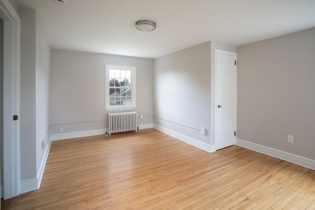 329 Read St, Somerset, MA 02726 - spare room featuring radiator and light wood finished floors