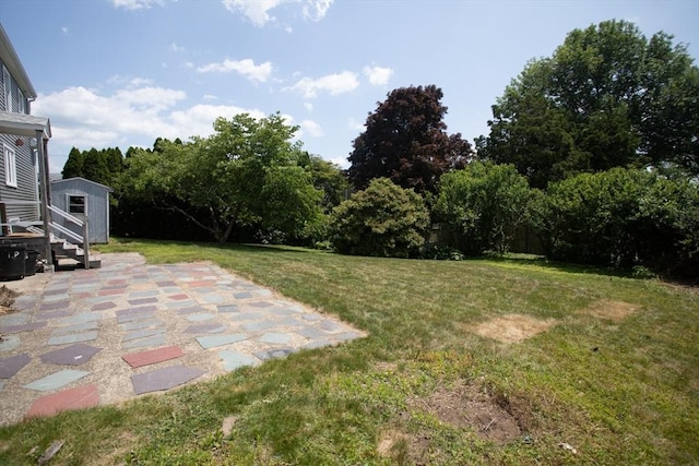 329 Read St, Somerset, MA 02726 - view of green lawn featuring a patio and a storage shed