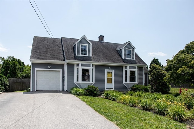 329 Read St, Somerset, MA 02726 - new england style home featuring a garage, driveway, a chimney, and a shingled roof