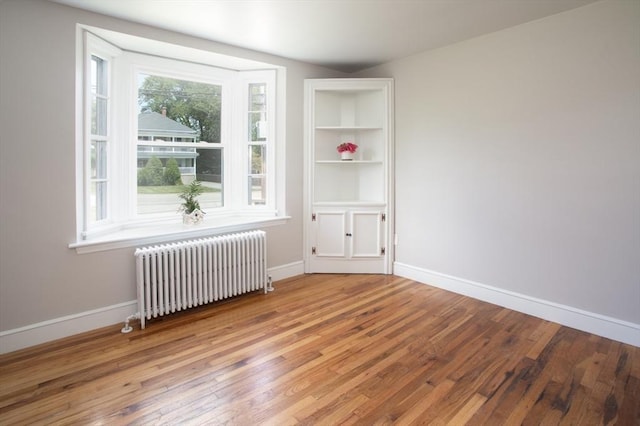 329 Read St, Somerset, MA 02726 - spare room featuring radiator heating unit and hardwood / wood-style flooring