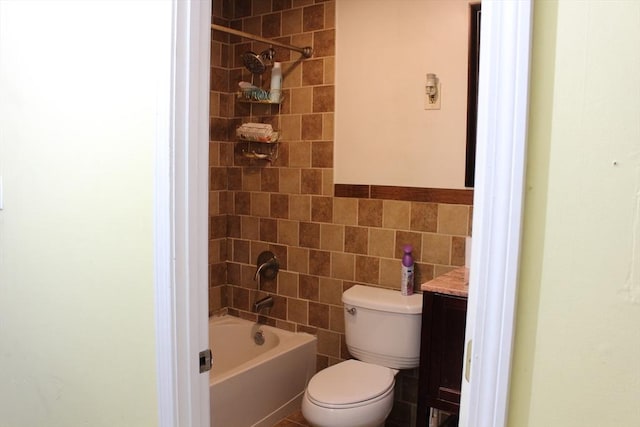 bathroom featuring shower / tub combination, tile walls, and toilet