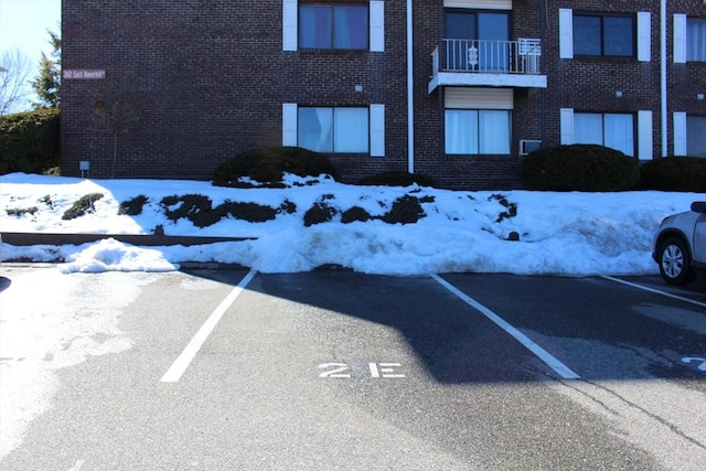 view of snow covered parking