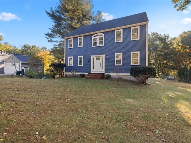 colonial home featuring a front yard