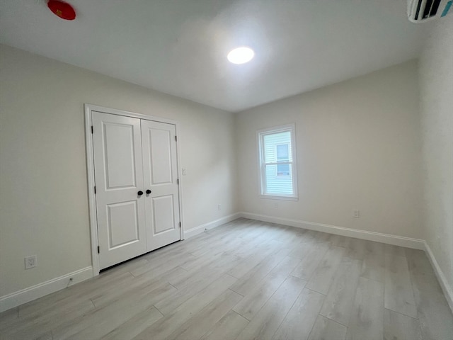 unfurnished room with light hardwood / wood-style flooring