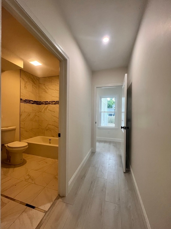 corridor featuring light hardwood / wood-style flooring