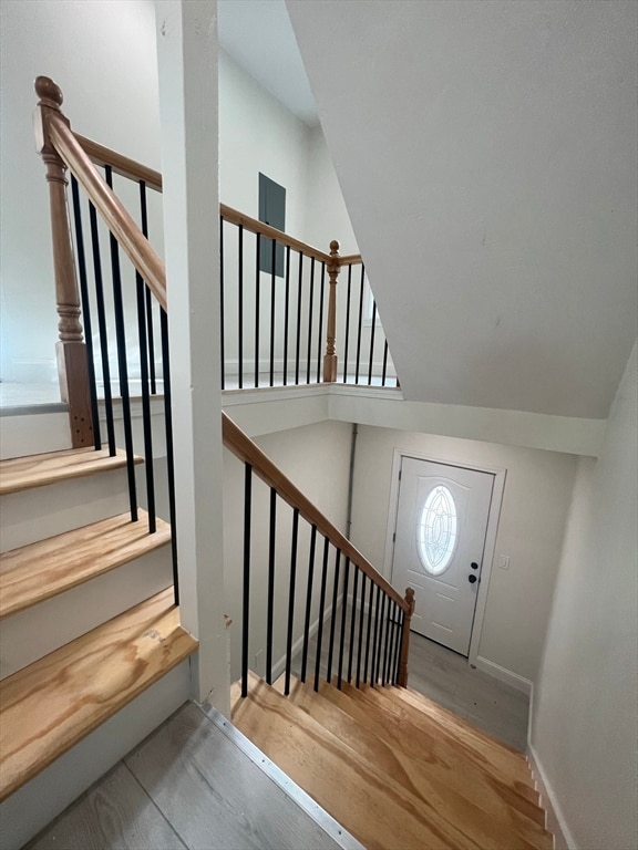 stairs featuring wood-type flooring