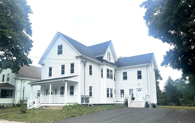 view of property exterior with a porch