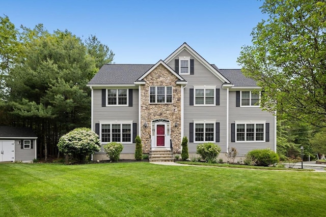 1 Eleanor Dr, Wilmington, MA 01887 - view of front of home with stone siding, a front yard, and entry steps