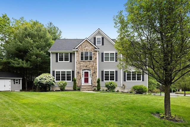 1 Eleanor Dr, Wilmington, MA 01887 - view of front facade with entry steps, stone siding, and a front lawn