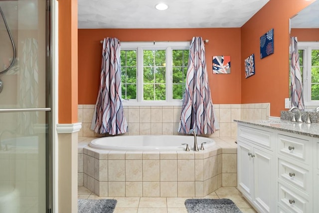 1 Eleanor Dr, Wilmington, MA 01887 - bathroom with vanity, a bath, a stall shower, and tile patterned flooring