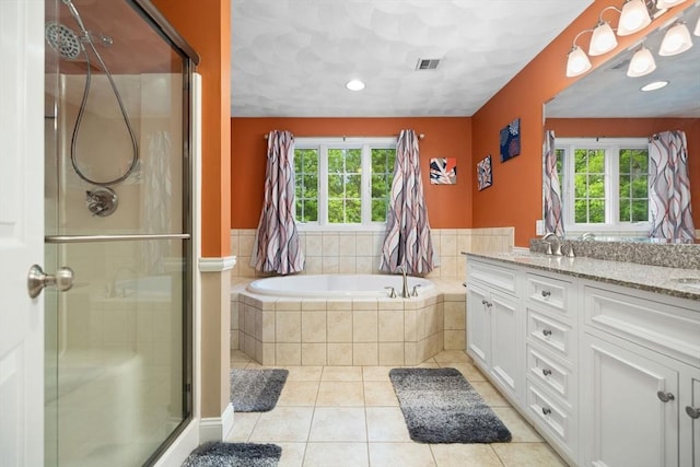 1 Eleanor Dr, Wilmington, MA 01887 - full bath with healthy amount of natural light, double vanity, a stall shower, and a garden tub