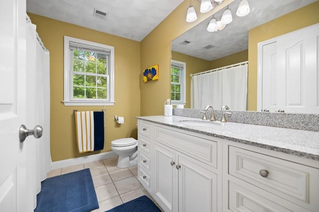 1 Eleanor Dr, Wilmington, MA 01887 - bathroom with vanity, toilet, baseboards, and tile patterned floors