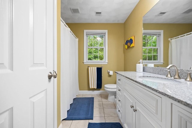 1 Eleanor Dr, Wilmington, MA 01887 - full bath with vanity, plenty of natural light, toilet, and tile patterned floors