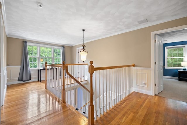 1 Eleanor Dr, Wilmington, MA 01887 - corridor featuring an upstairs landing, light wood-style floors, wainscoting, ornamental molding, and a decorative wall