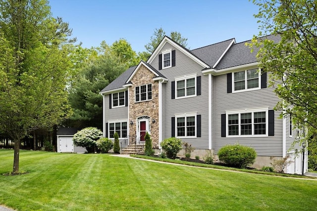 1 Eleanor Dr, Wilmington, MA 01887 - view of front of house with a front yard and stone siding