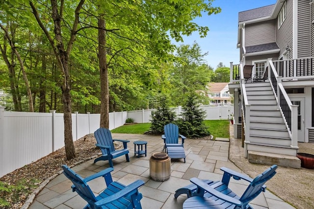 1 Eleanor Dr, Wilmington, MA 01887 - fenced backyard with stairway, a patio, and a deck