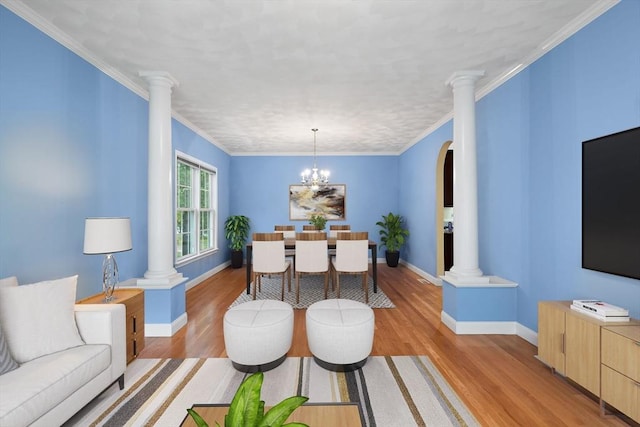 1 Eleanor Dr, Wilmington, MA 01887 - living area featuring ornate columns, light wood-type flooring, baseboards, and crown molding