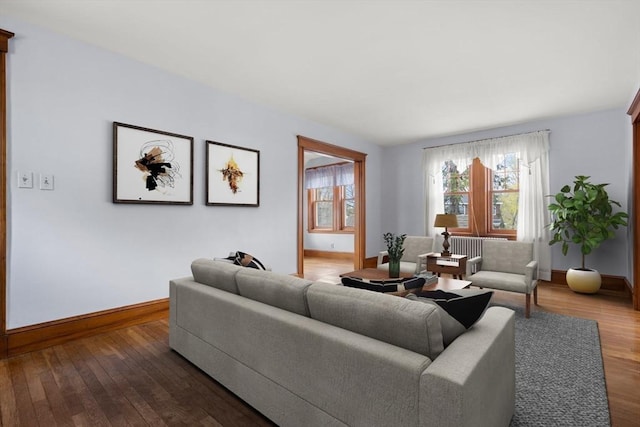 living area featuring wood finished floors and baseboards