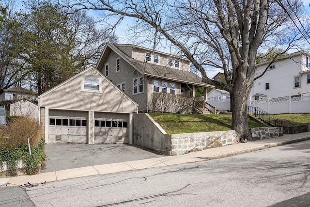 view of front of house with a front lawn and a garage