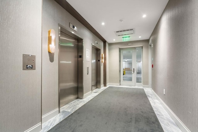 100 Shawmut Ave Unit 202, Boston, MA 02118 - hallway featuring elevator, baseboards, and carpet floors