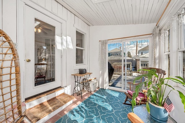 sunroom / solarium with wood ceiling and lofted ceiling