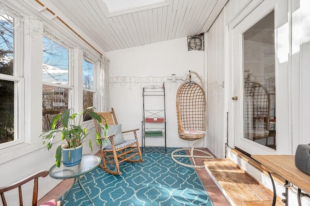 sunroom / solarium with lofted ceiling and wooden ceiling