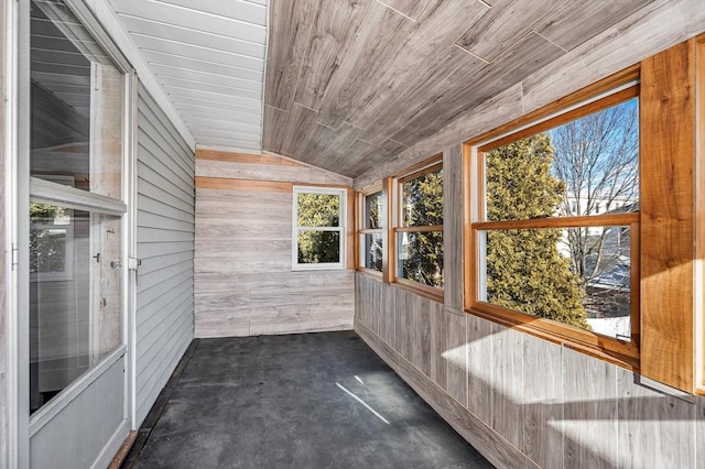 unfurnished sunroom with vaulted ceiling and wooden ceiling