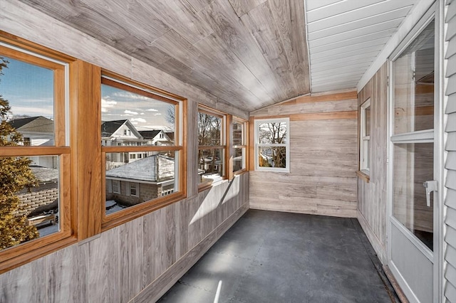 unfurnished sunroom featuring lofted ceiling and wood ceiling