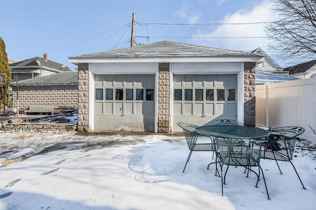 view of snow covered garage