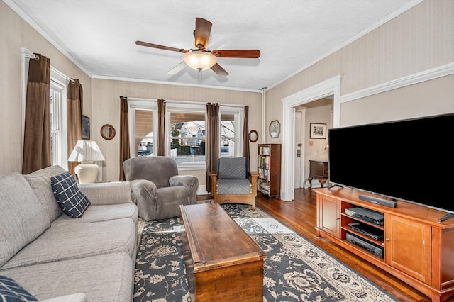 living room featuring crown molding, dark hardwood / wood-style floors, and ceiling fan