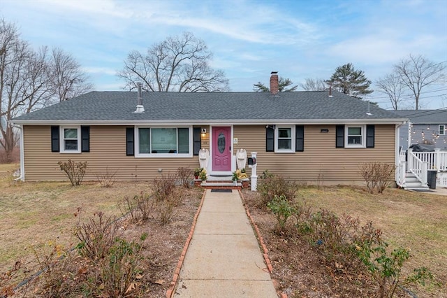 ranch-style house with a front lawn