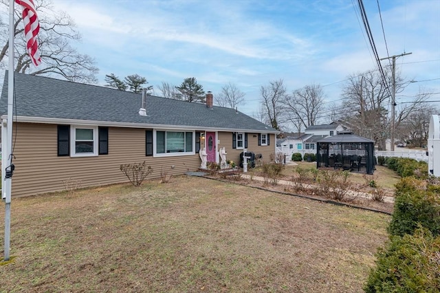 ranch-style house with a gazebo and a front lawn