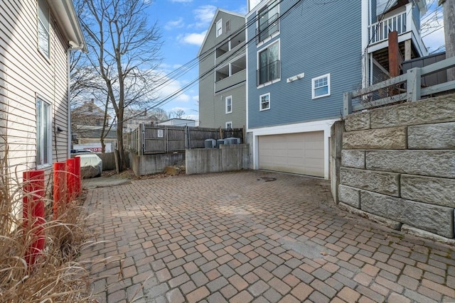 view of side of home with a garage