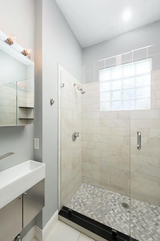 1411 Washington St Unit 7, Boston, MA 02118 - bathroom with a shower stall, vanity, tile patterned flooring, and baseboards