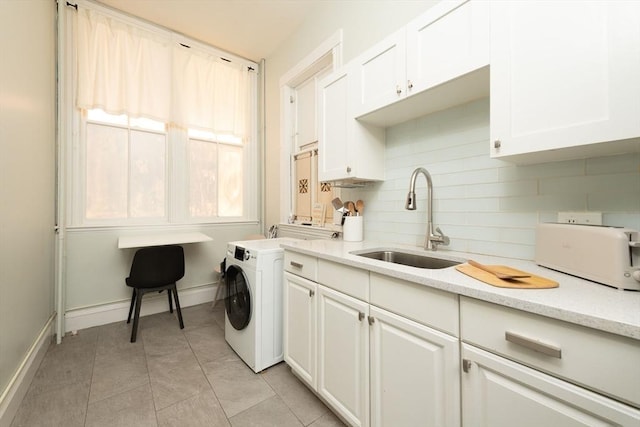 1411 Washington St Unit 7, Boston, MA 02118 - laundry room featuring baseboards, washer / clothes dryer, and light tile patterned flooring
