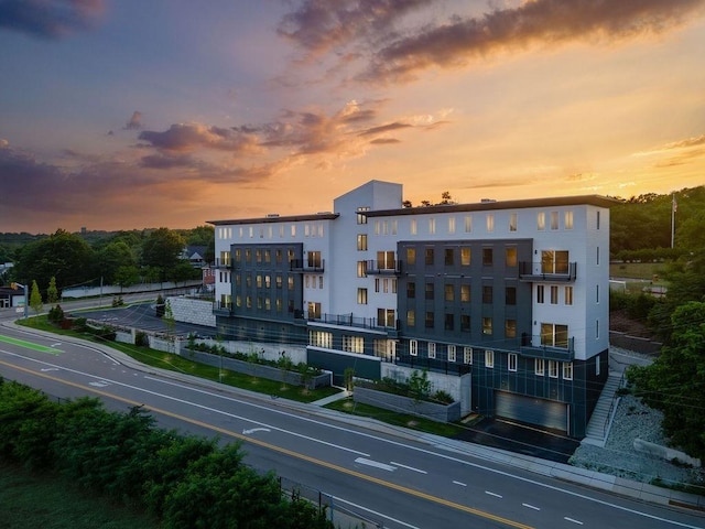 view of outdoor building at dusk