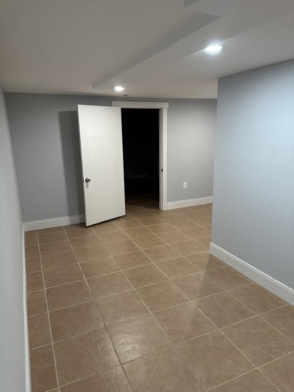 basement with light tile patterned floors