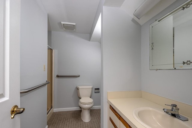 bathroom with vanity, a shower with shower door, tile patterned floors, and toilet