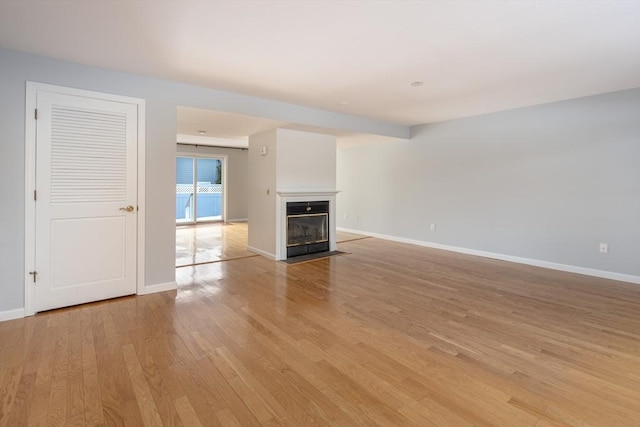 unfurnished living room featuring light hardwood / wood-style floors