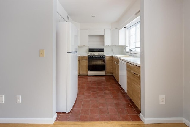 kitchen featuring sink, white appliances, white cabinetry, tile patterned flooring, and tasteful backsplash