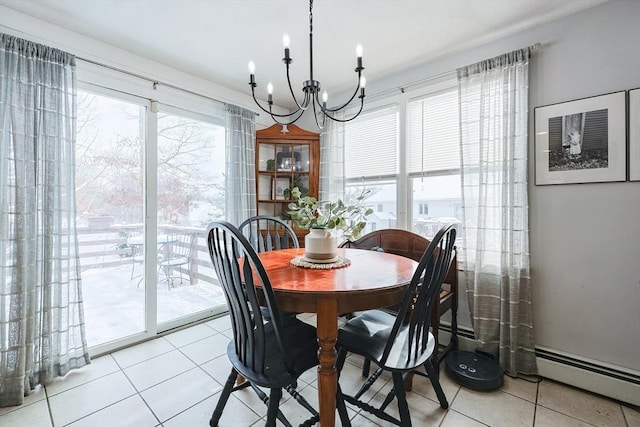 dining space featuring plenty of natural light, a baseboard heating unit, light tile patterned floors, and a notable chandelier