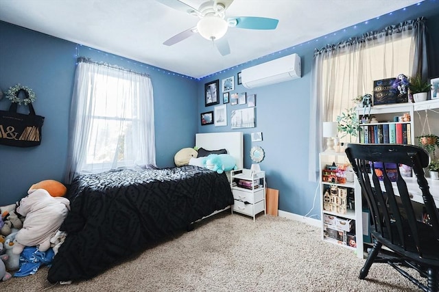 carpeted bedroom featuring a wall unit AC and ceiling fan