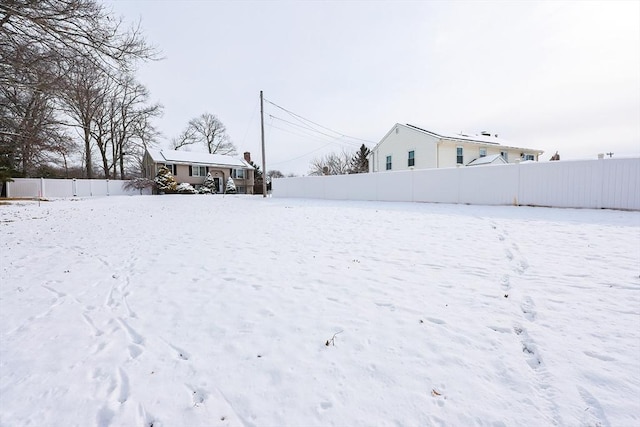 view of yard covered in snow