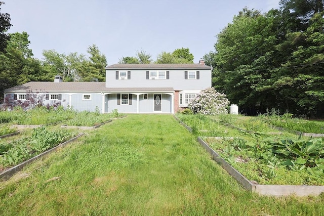 54 Mountain View Rd, Leominster, MA 01453 - rear view of house featuring a vegetable garden, a chimney, and a yard