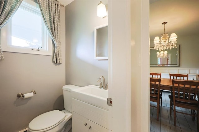 54 Mountain View Rd, Leominster, MA 01453 - half bathroom with vanity, a chandelier, toilet, and tile patterned flooring