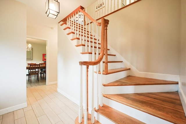 54 Mountain View Rd, Leominster, MA 01453 - staircase featuring baseboards and a chandelier