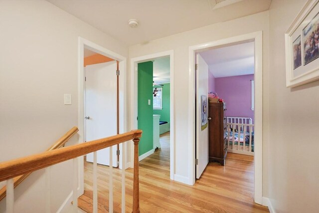 54 Mountain View Rd, Leominster, MA 01453 - hallway with an upstairs landing, light wood-style flooring, and baseboards