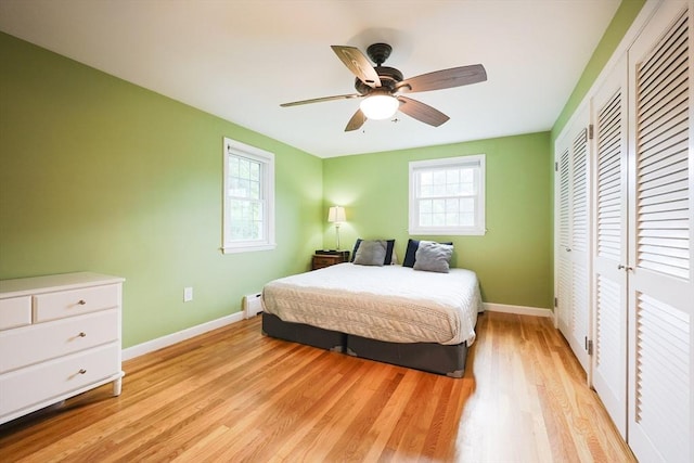 54 Mountain View Rd, Leominster, MA 01453 - bedroom with baseboards, light wood finished floors, a closet, a ceiling fan, and a baseboard heating unit