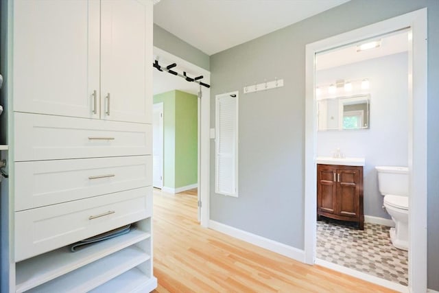 54 Mountain View Rd, Leominster, MA 01453 - bathroom with toilet, vanity, and baseboards